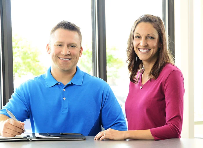 4imprint employees Josh and Libby welcoming you to connect with them